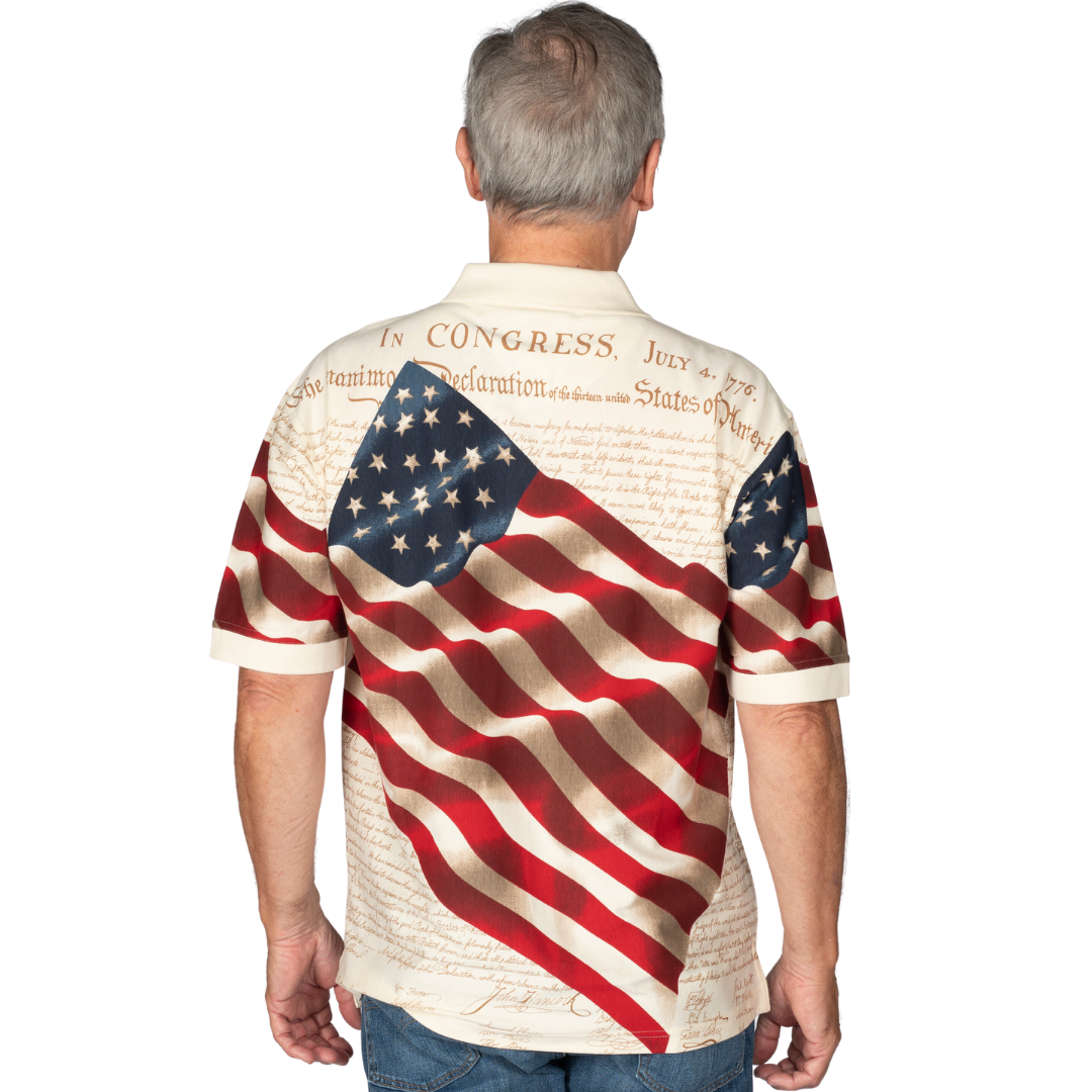 Emblazoned with the iconic text of the Declaration of Independence and a resolute waving flag on front and back of Natural color shirt 100% Cotton